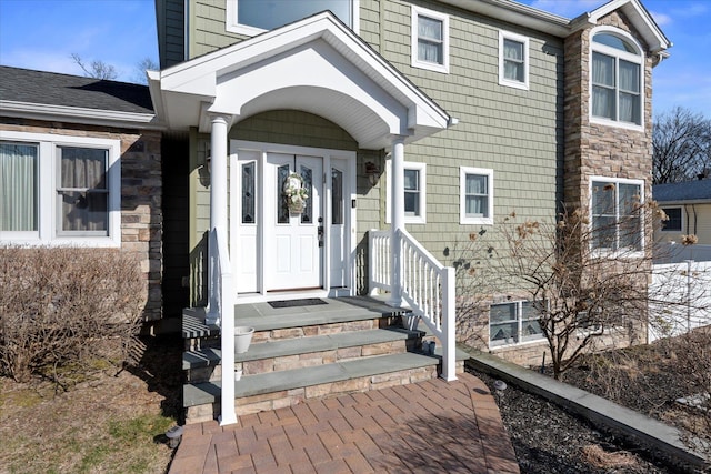 view of exterior entry with stone siding