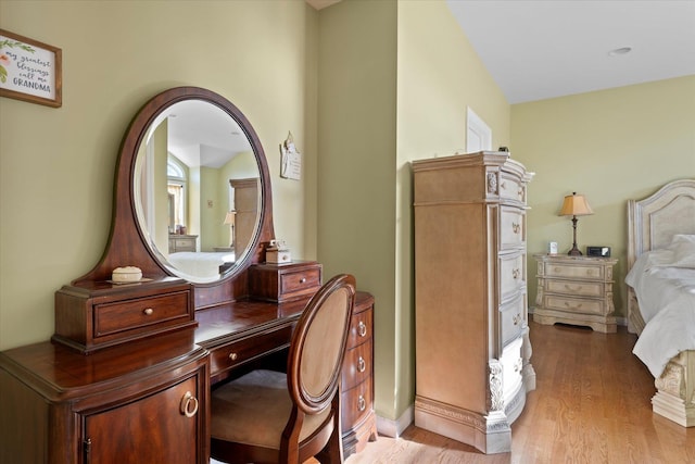 bedroom with light wood-style floors