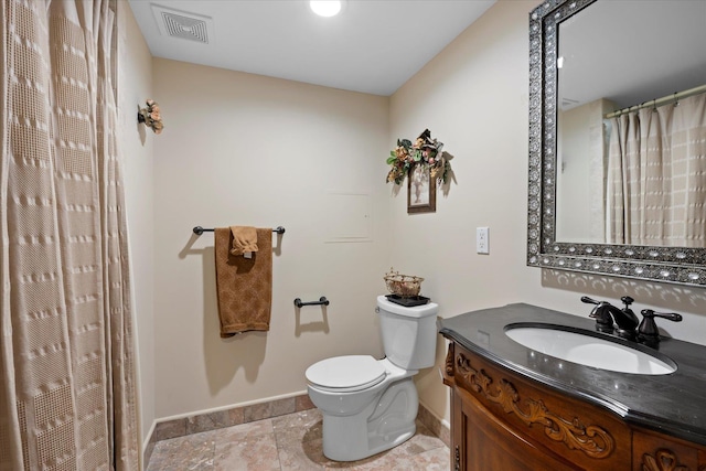 bathroom featuring visible vents, baseboards, toilet, and vanity