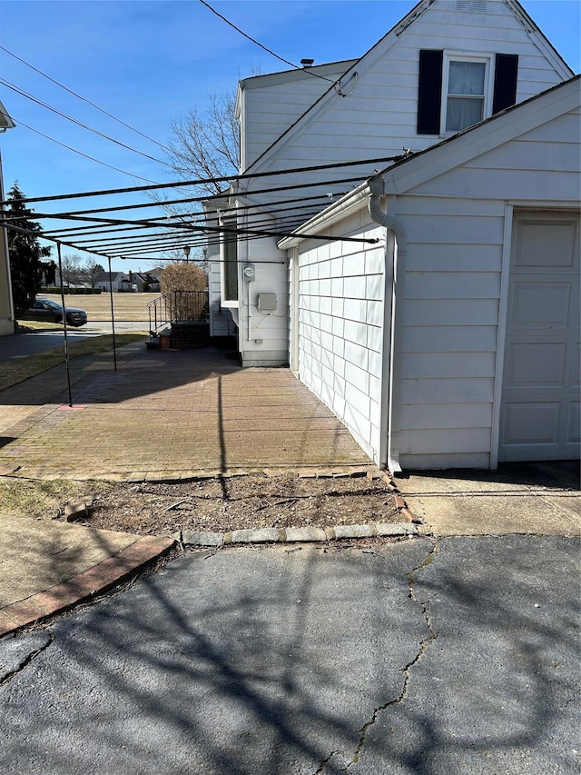 view of side of property featuring a garage