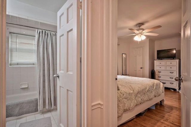 bedroom featuring light wood-style flooring and ceiling fan