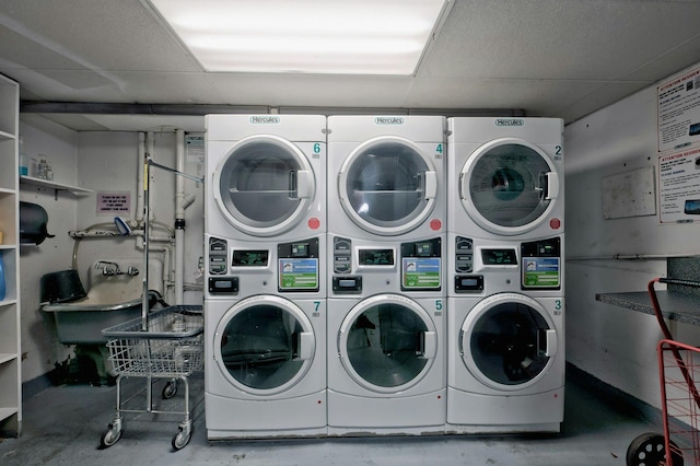 community laundry room with stacked washer / drying machine and separate washer and dryer