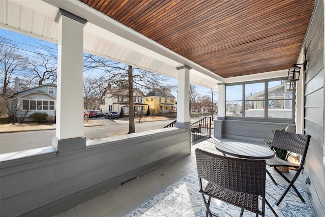 interior space with wooden ceiling and a residential view