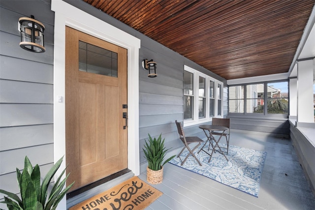 doorway to property featuring covered porch