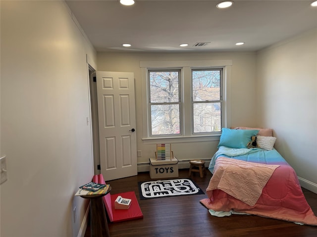 bedroom with visible vents, recessed lighting, baseboards, and wood finished floors