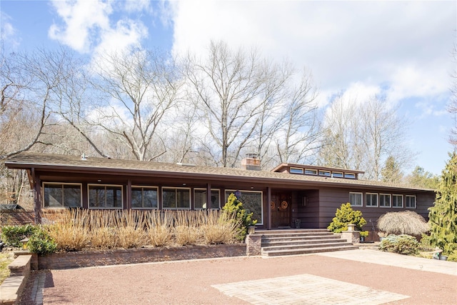 view of front of home with a chimney