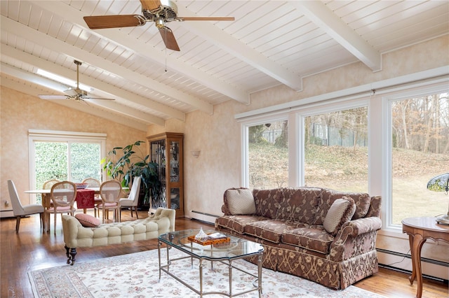 living area featuring vaulted ceiling with beams, wood finished floors, and a baseboard radiator