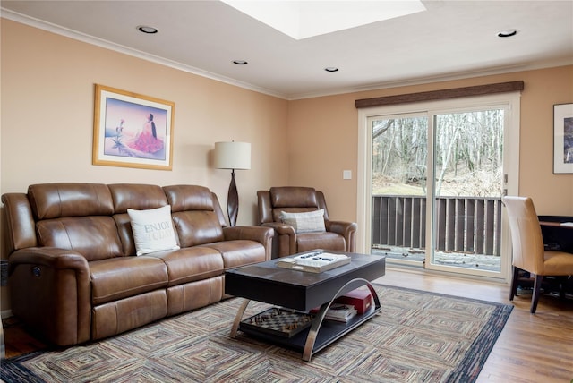 living area featuring recessed lighting, wood finished floors, and crown molding