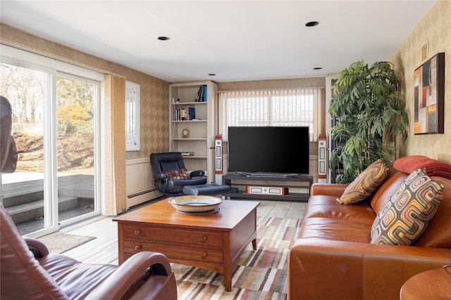 living room with wainscoting and wallpapered walls