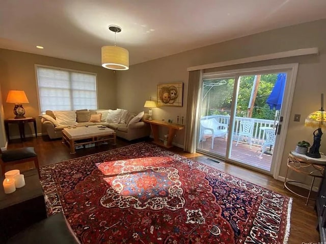 living room with wood finished floors and baseboards