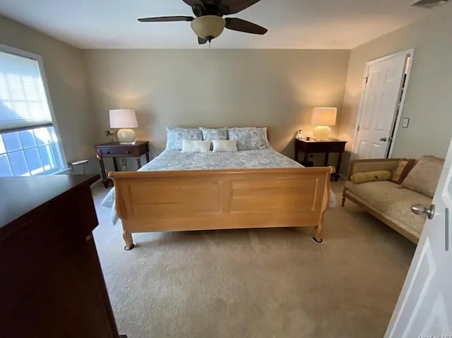 bedroom with dark carpet and ceiling fan