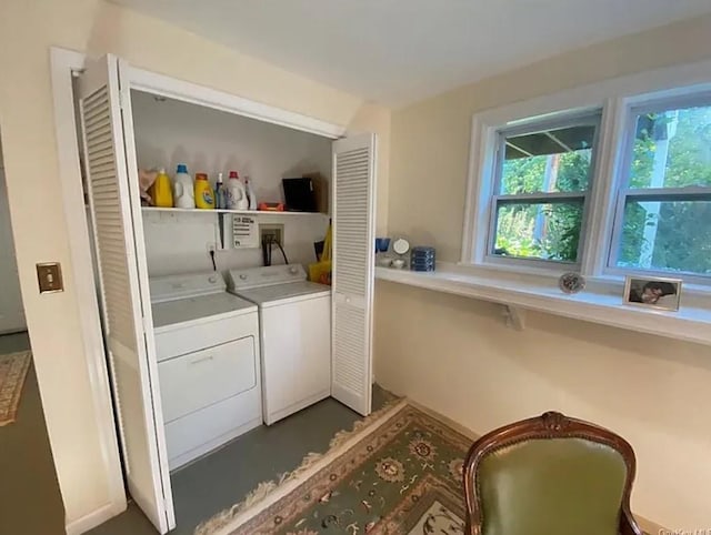 laundry area featuring laundry area, a wealth of natural light, and washer and clothes dryer