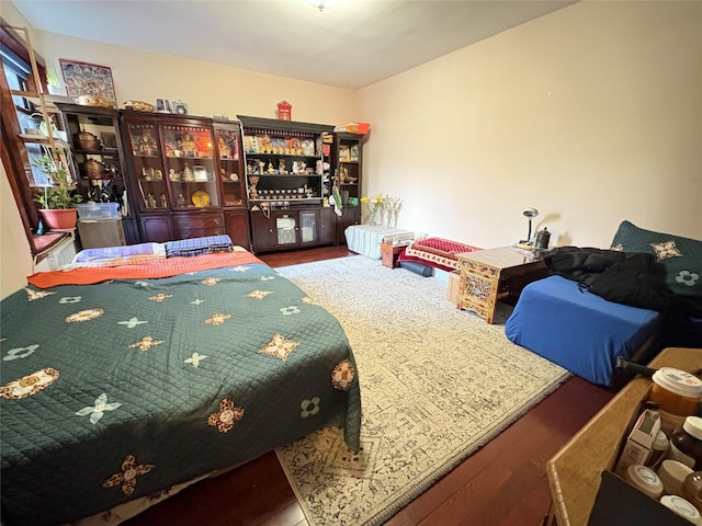 bedroom with wood finished floors