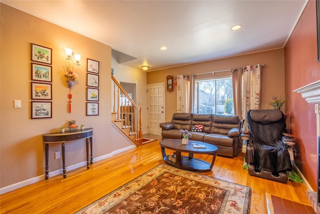 living room with recessed lighting, stairway, baseboards, and hardwood / wood-style flooring