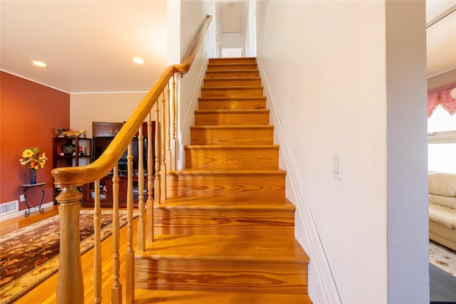 stairway with visible vents, recessed lighting, baseboards, and wood finished floors