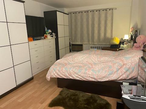 bedroom featuring light wood finished floors