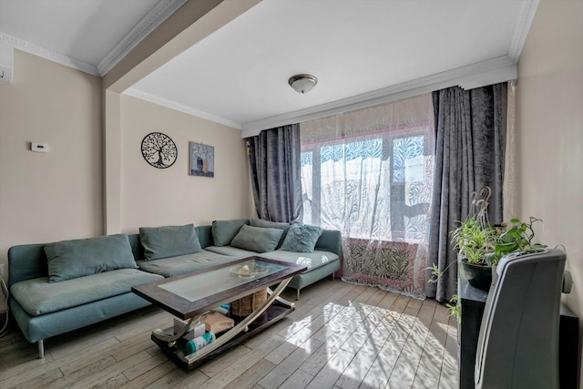 living room with wood finished floors and ornamental molding