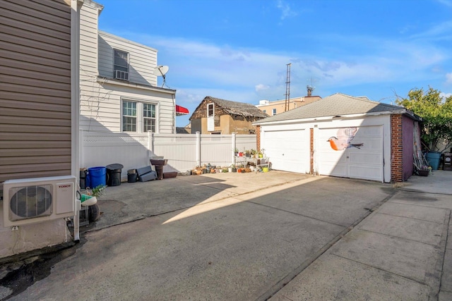 exterior space featuring ac unit and fence