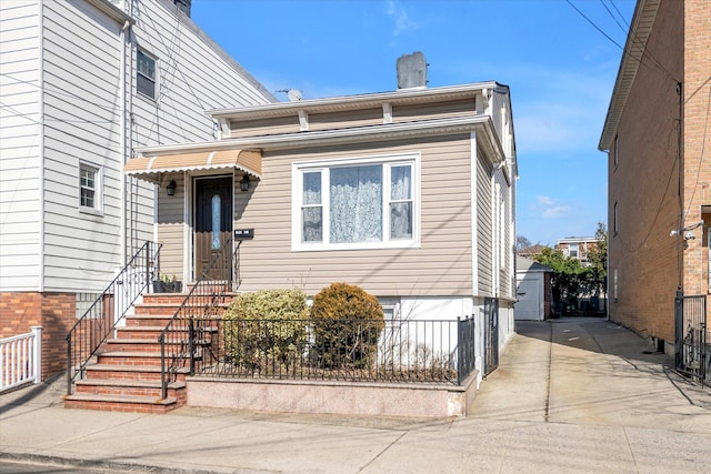 view of front of house with fence