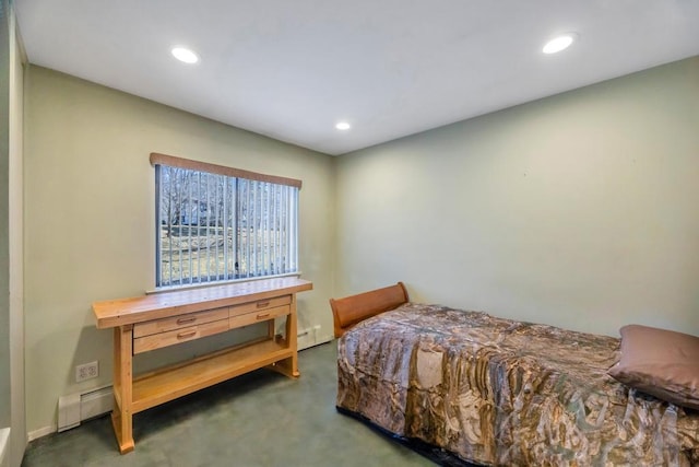 bedroom with recessed lighting and a baseboard radiator