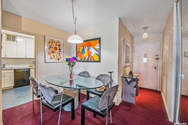 dining room featuring visible vents and baseboards