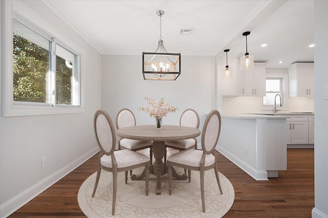 dining room featuring an inviting chandelier, baseboards, visible vents, and dark wood-style flooring