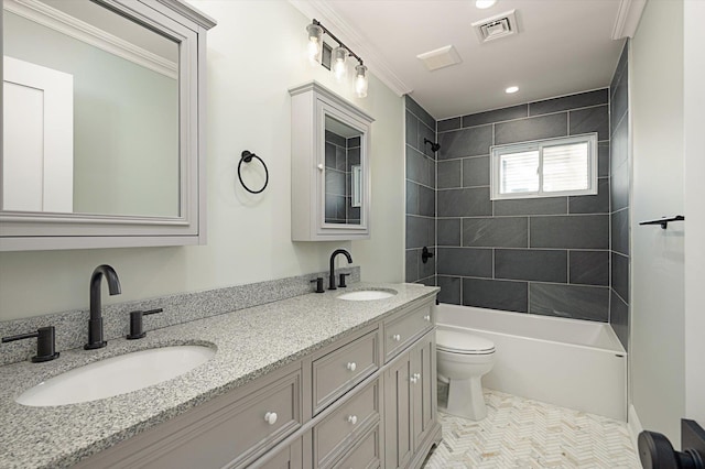 full bathroom with double vanity, toilet, visible vents, and a sink