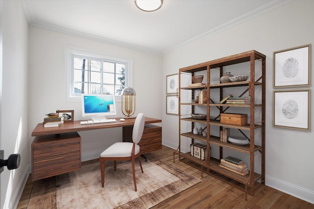 office space with ornamental molding, baseboards, and wood finished floors