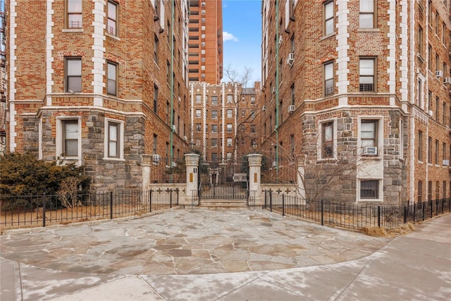 view of property with fence