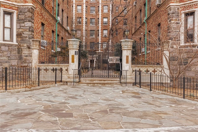 view of gate with fence