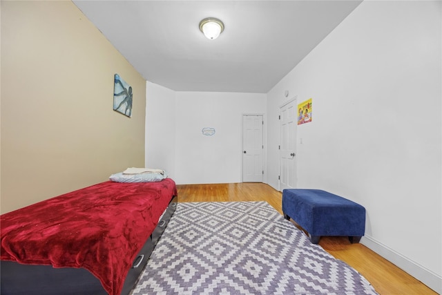 bedroom featuring wood finished floors