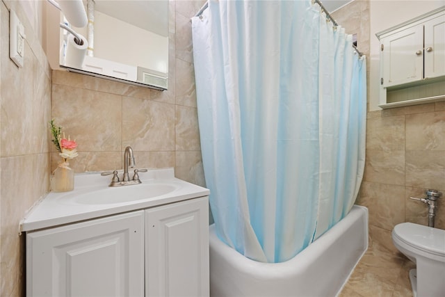 bathroom featuring shower / tub combo with curtain, tile walls, vanity, and toilet