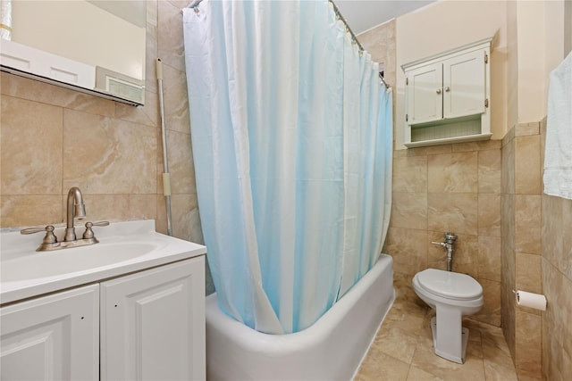 bathroom with vanity, tile walls, shower / bath combination with curtain, and toilet