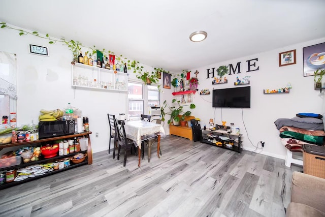 dining space featuring wood finished floors