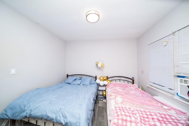bedroom featuring wood finished floors