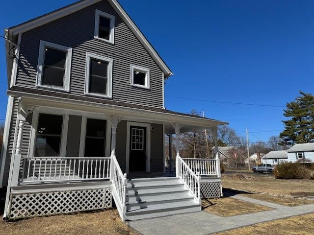 country-style home featuring a porch