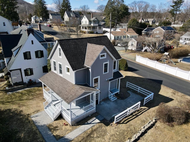 birds eye view of property with a residential view