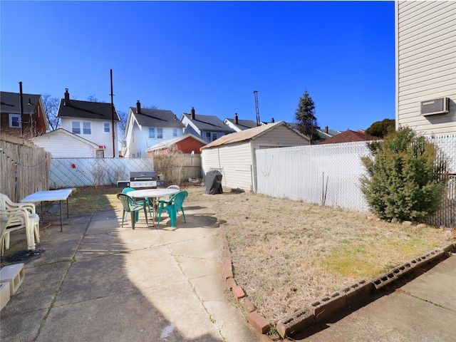 view of yard with a patio area, a residential view, and a fenced backyard