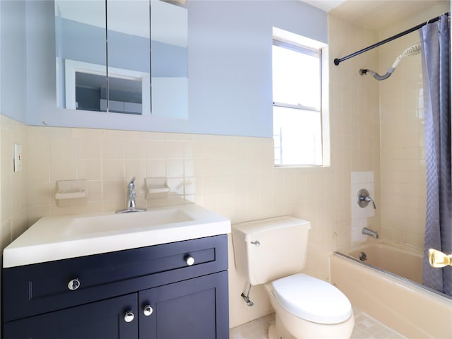 bathroom with shower / tub combo with curtain, tile walls, vanity, and toilet