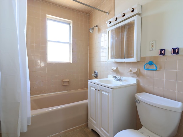 full bathroom with vanity, tile walls, shower / bath combination with curtain, and toilet