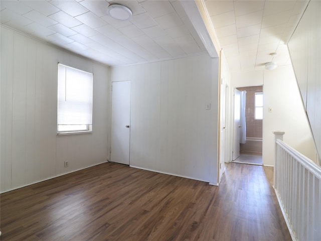 unfurnished room featuring dark wood finished floors