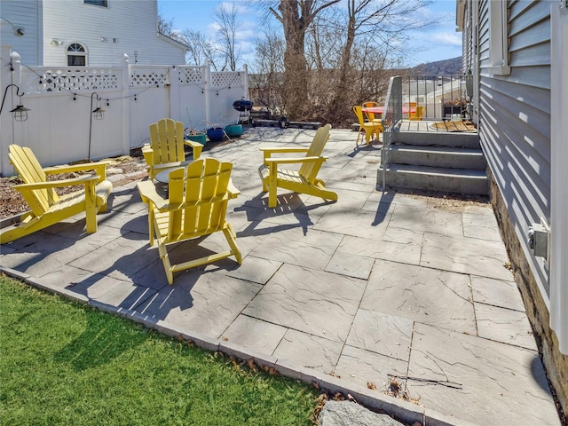 view of patio / terrace featuring fence