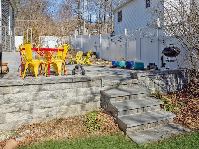 exterior space featuring area for grilling, a gate, and fence