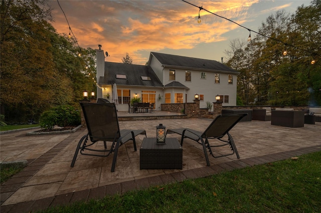 exterior space with outdoor dining area and an outdoor hangout area