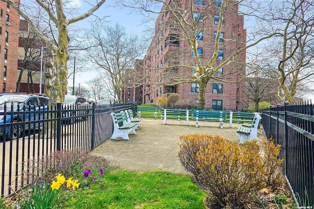 view of property's community with fence