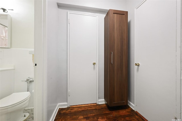 bathroom featuring toilet and wood finished floors