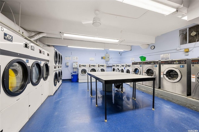 shared laundry area with stacked washer and dryer and washer and clothes dryer