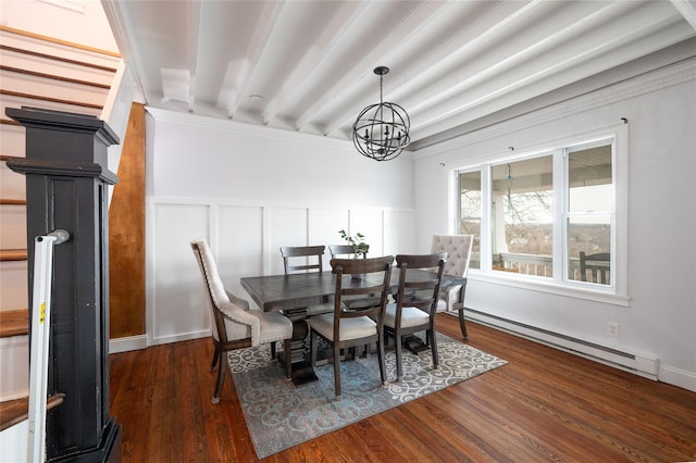 dining area with wood finished floors, a wainscoted wall, a baseboard heating unit, beamed ceiling, and a chandelier