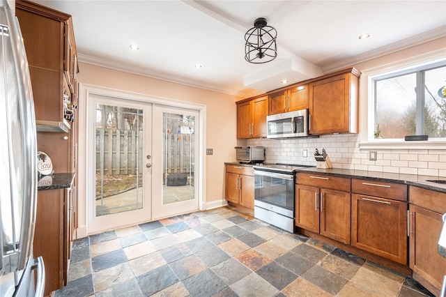 kitchen featuring brown cabinetry, backsplash, stainless steel appliances, and ornamental molding