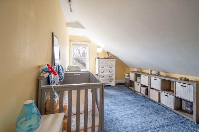 carpeted bedroom with vaulted ceiling